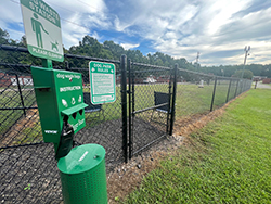 The double gate entrance to the 50 foot by 100 foot fenced in dog park.